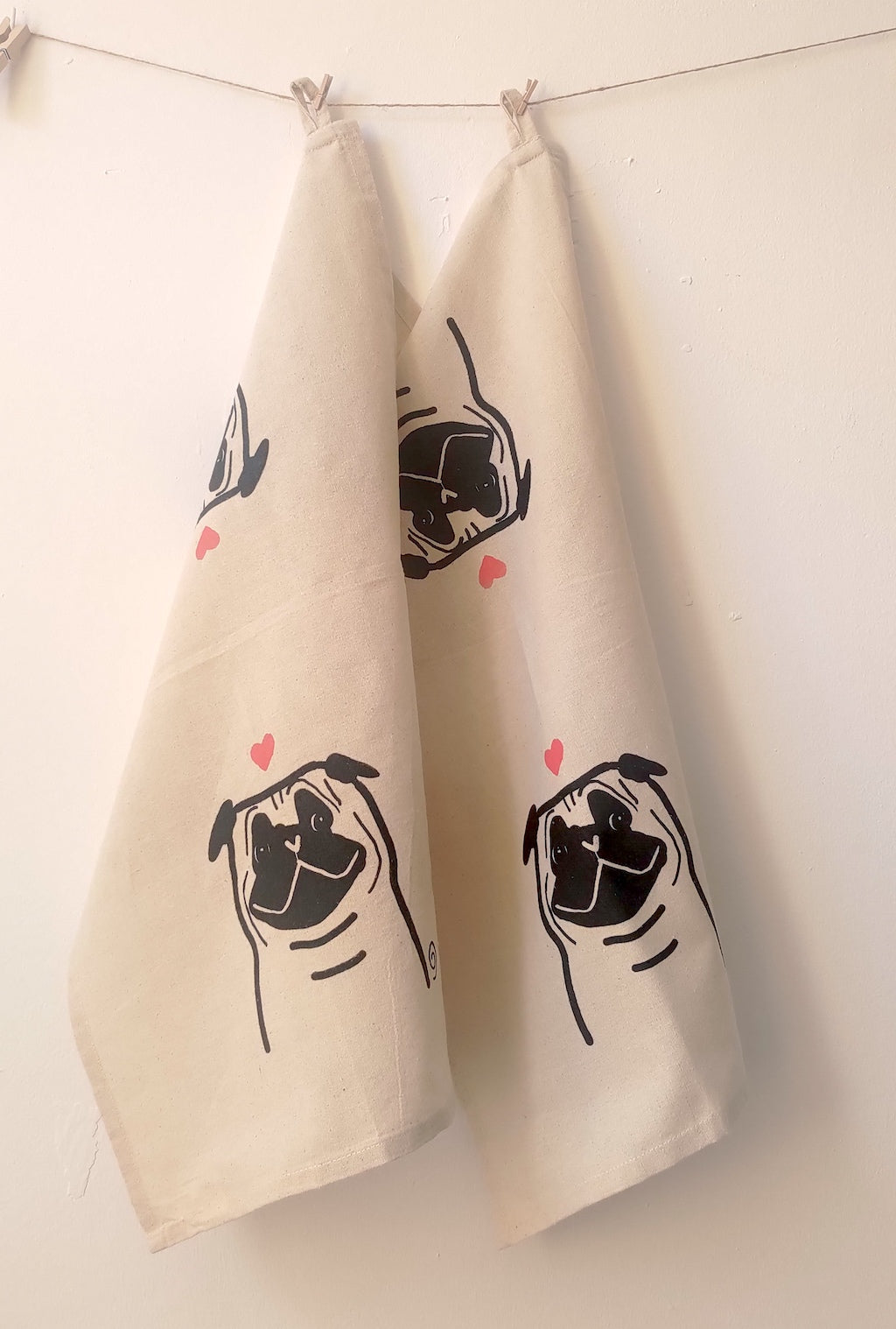 Handmade pug dog with heart on cotton tea towel by Studio Carla Ventresca Miller Art